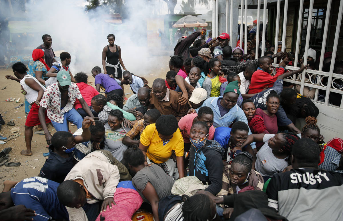 Residents desperate for a planned distribution of food for those suffering under Kenya's corona ...