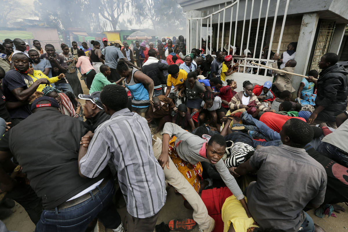 Residents desperate for a planned distribution of food for those suffering under Kenya's corona ...