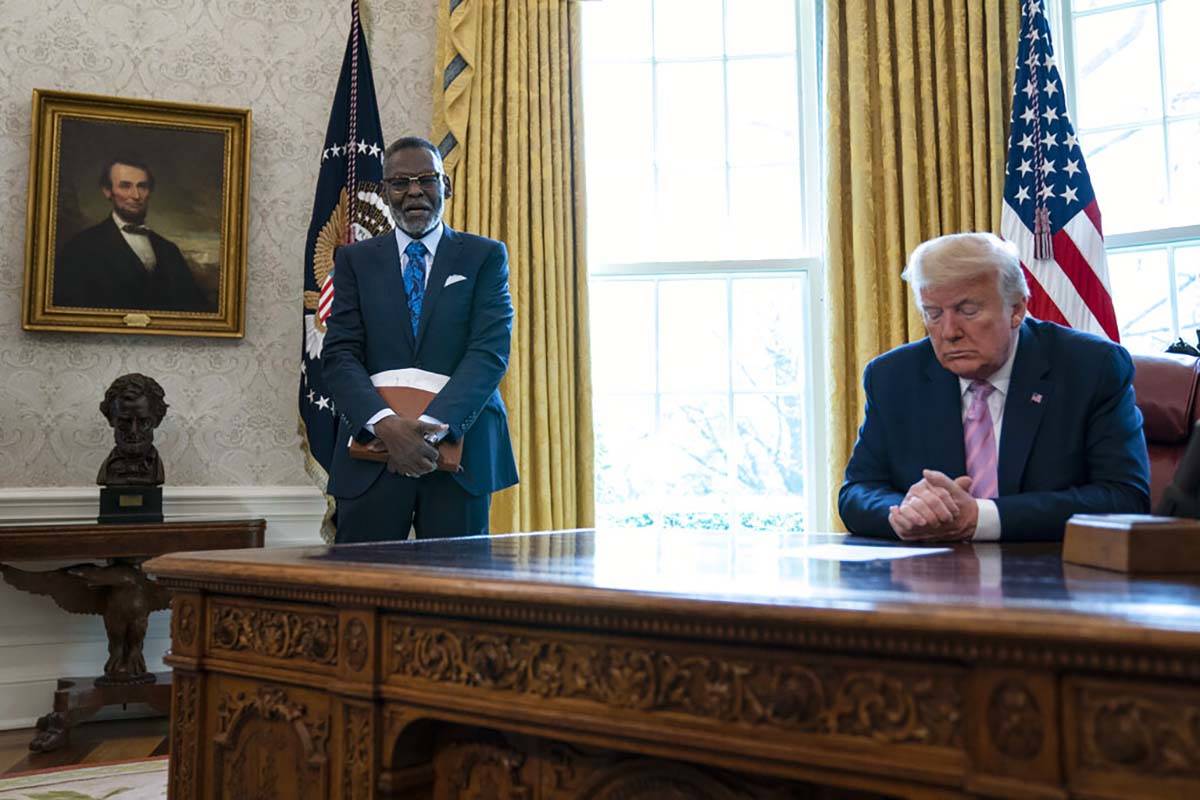 President Donald Trump prays during an Easter blessing event with Bishop Harry Jackson, in the ...