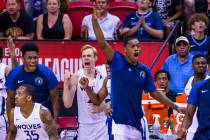 Minnesota Timberwolves' players cheer on their teammates as the close the gap versus the Memphi ...