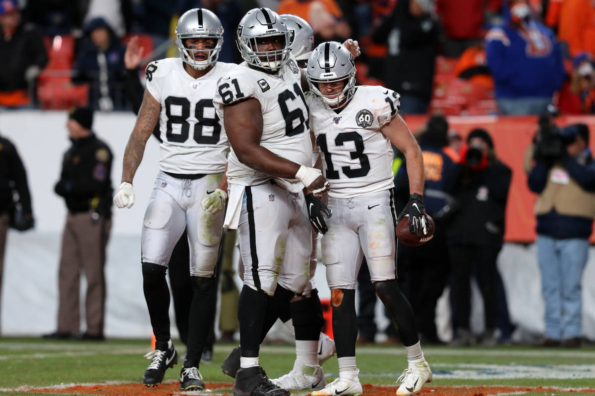 Oakland Raiders wide receiver Hunter Renfrow (13) celebrates his touchdown reception with wide ...