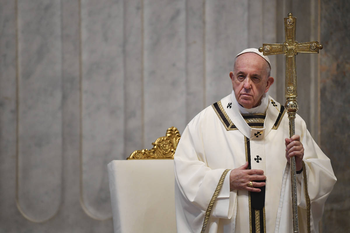 Pope Francis attends Easter Sunday Mass, inside an empty St. Peter's Basilica at the Vatican, S ...