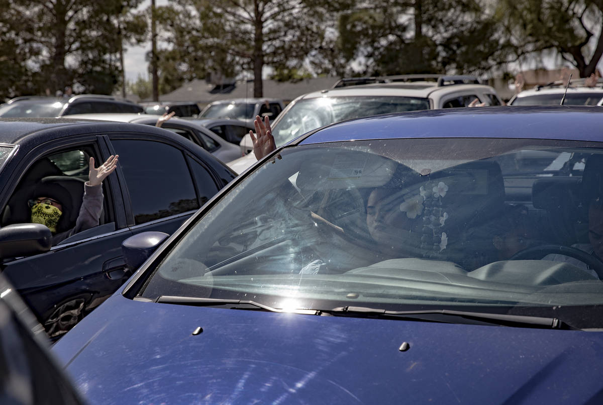 Guests attend an Easter service in the parking lot at International Church of Las Vegas in Las ...