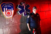 Paramedic Travis Kessel is photographed outside his station house after working a shift amid th ...