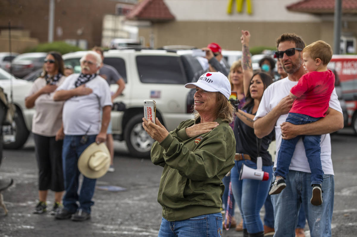 Participants recite the Pledge of Allegiance during the start of the Nevada Caravan Protest of ...