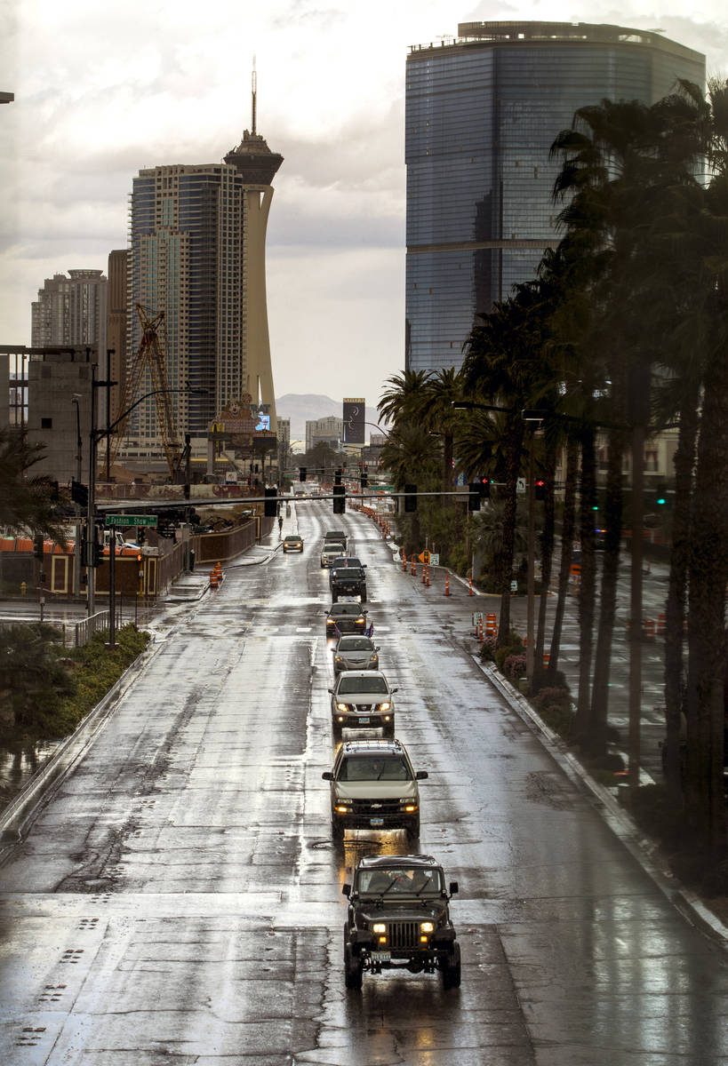Vehicles make their way down the Las Vegas Strip during the Nevada Caravan Protest of Governmen ...