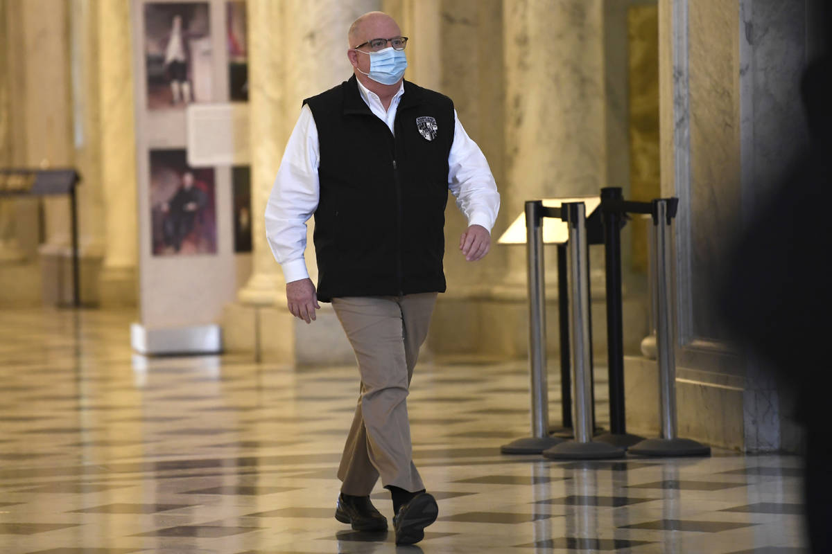 Maryland Gov. Larry Hogan arrives for a news conference in Annapolis, Md., Friday, April 10, 20 ...