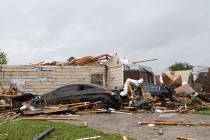 A home had its roof torn off after a tornado ripped through Monroe, La. just before noon on Sun ...
