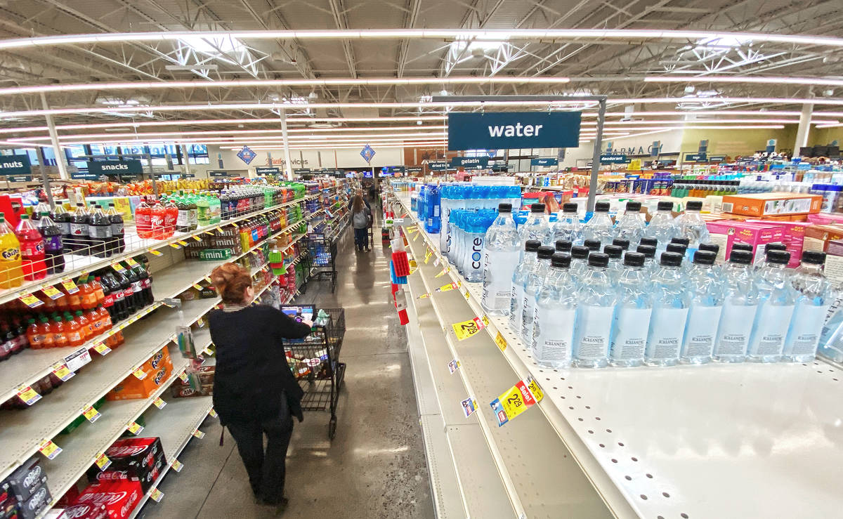 Shoppers faced many empty aisles while stocking up on essentials at Albertsons at 6730 N Hualap ...