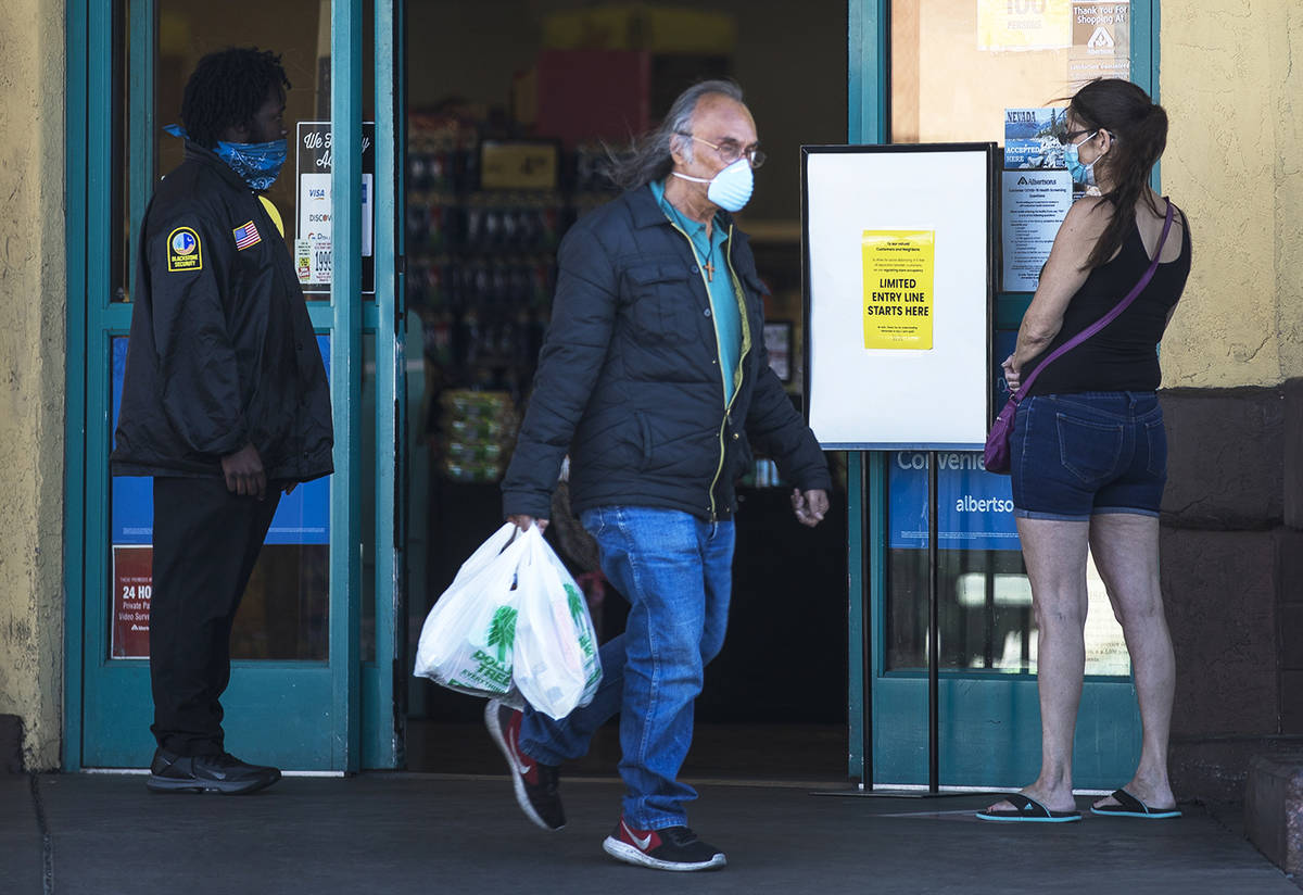 Customers coming and going from the Albertsons on Charleston in Las Vegas, Monday, April 13, 20 ...