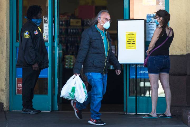 Customers coming and going from the Albertsons on Charleston in Las Vegas, Monday, April 13, 20 ...