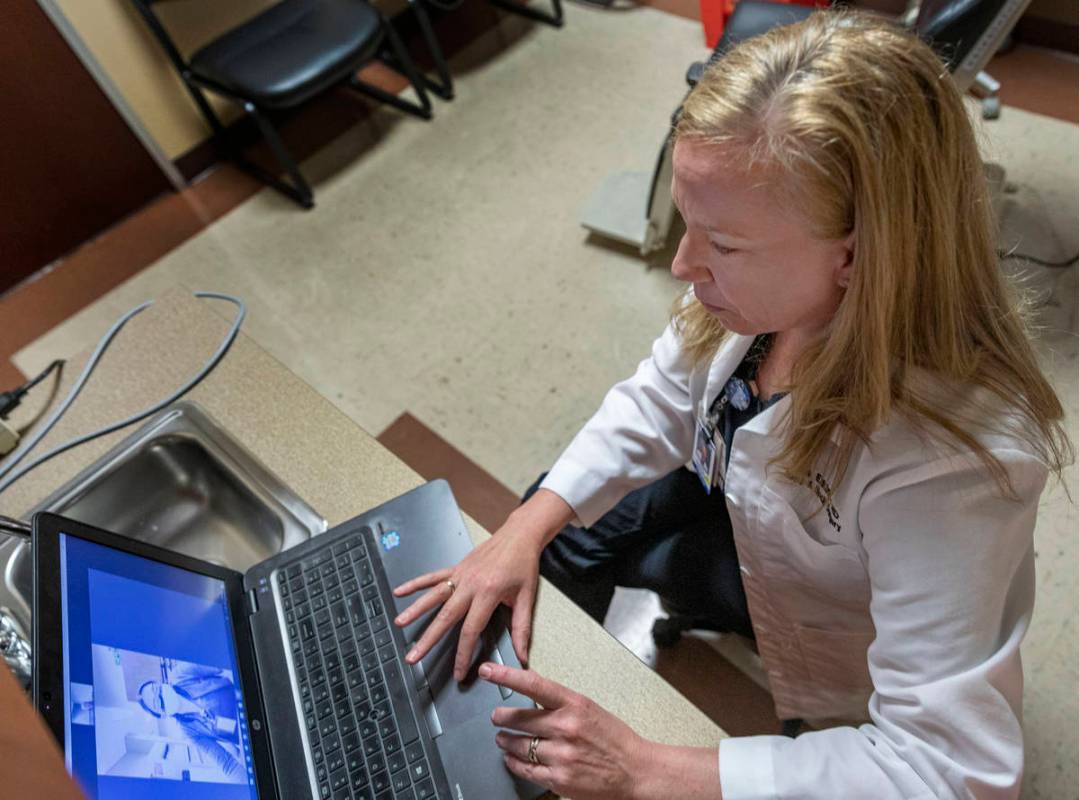 Dr. Tina Elkins, assistant professor of general otolaryngology at UNLV School of Medicine, demo ...