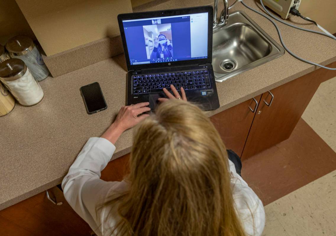 Dr. Tina Elkins, assistant professor of general otolaryngology at UNLV School of Medicine, demo ...