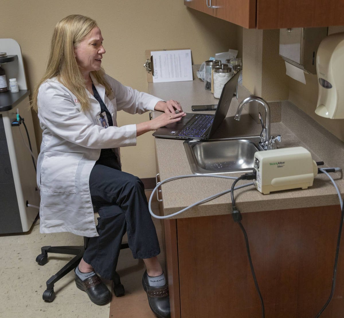 Dr. Tina Elkins, assistant professor of general otolaryngology at UNLV School of Medicine, demo ...