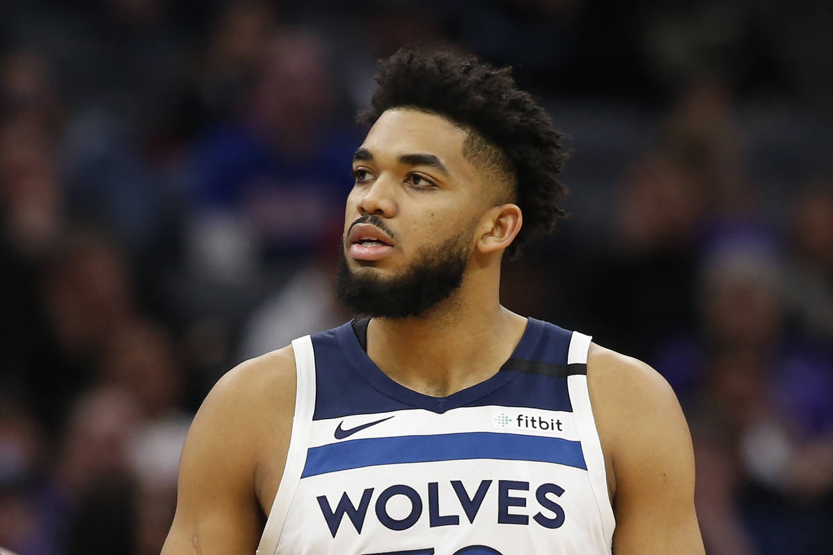 FILE - In this Feb. 3, 2020, file photo, Minnesota Timberwolves center Karl-Anthony Towns is sh ...