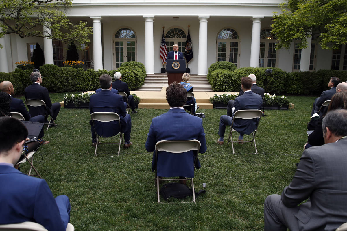 President Donald Trump speaks about the coronavirus in the Rose Garden of the White House, Tues ...