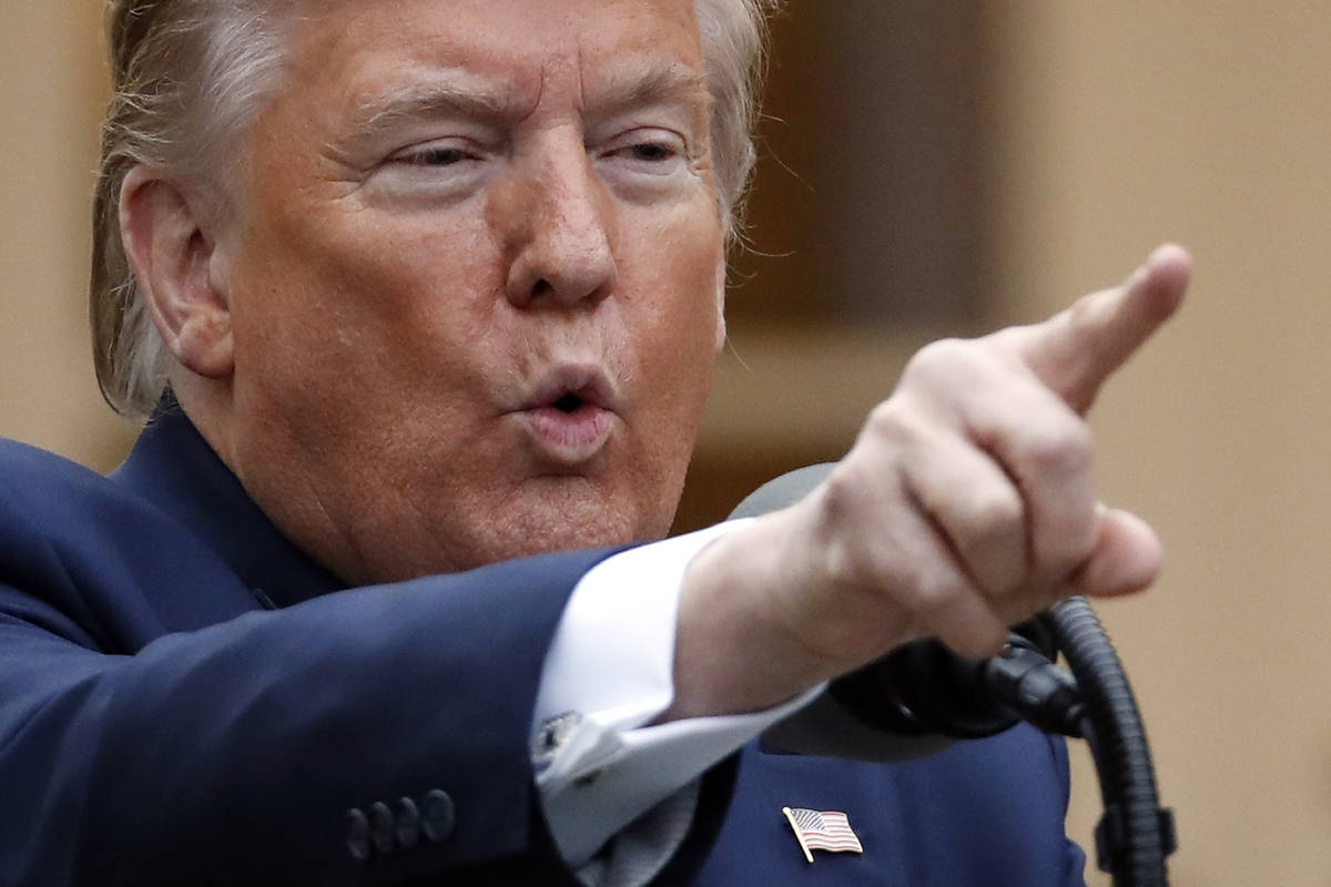 President Donald Trump speaks about the coronavirus in the Rose Garden of the White House, Tues ...