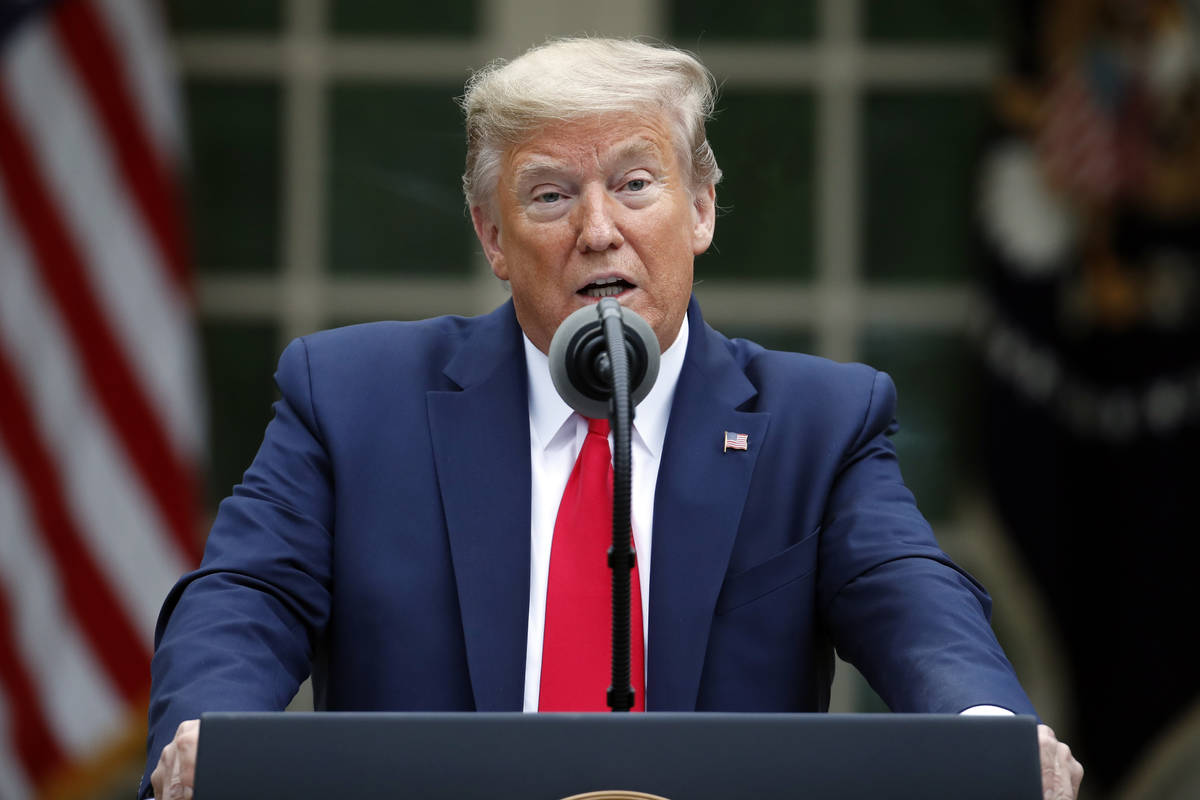 President Donald Trump speaks about the coronavirus in the Rose Garden of the White House, Tues ...