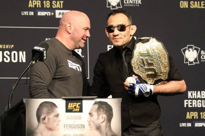 UFC president Dana White, left, speaks with UFC lightweight Tony Ferguson during the UFC 249 pr ...