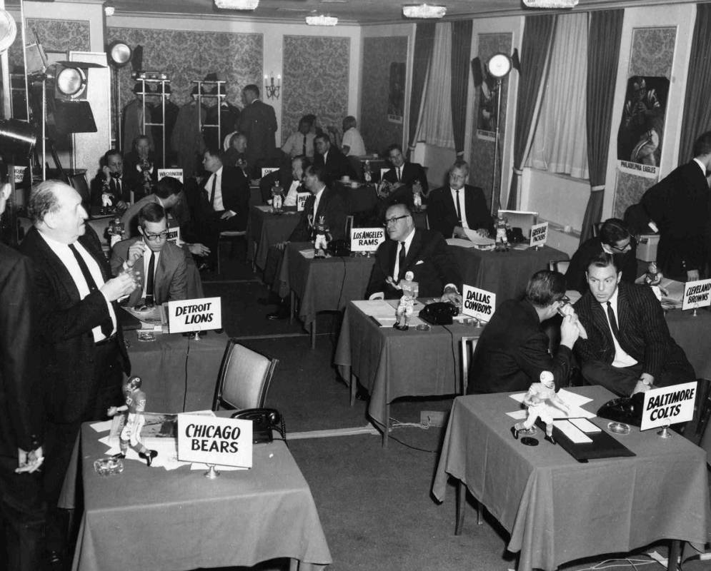 Representatives from the various teams gather for the 1966 NFL Draft held on November 27, 1965, ...