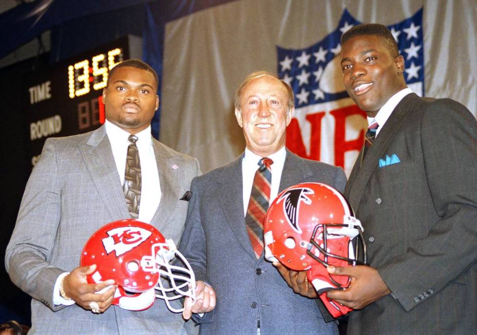 NFL commissioner Pete Rozelle stands with Nebraska's Neil Smith, left, and Auburn's Aundray Bru ...