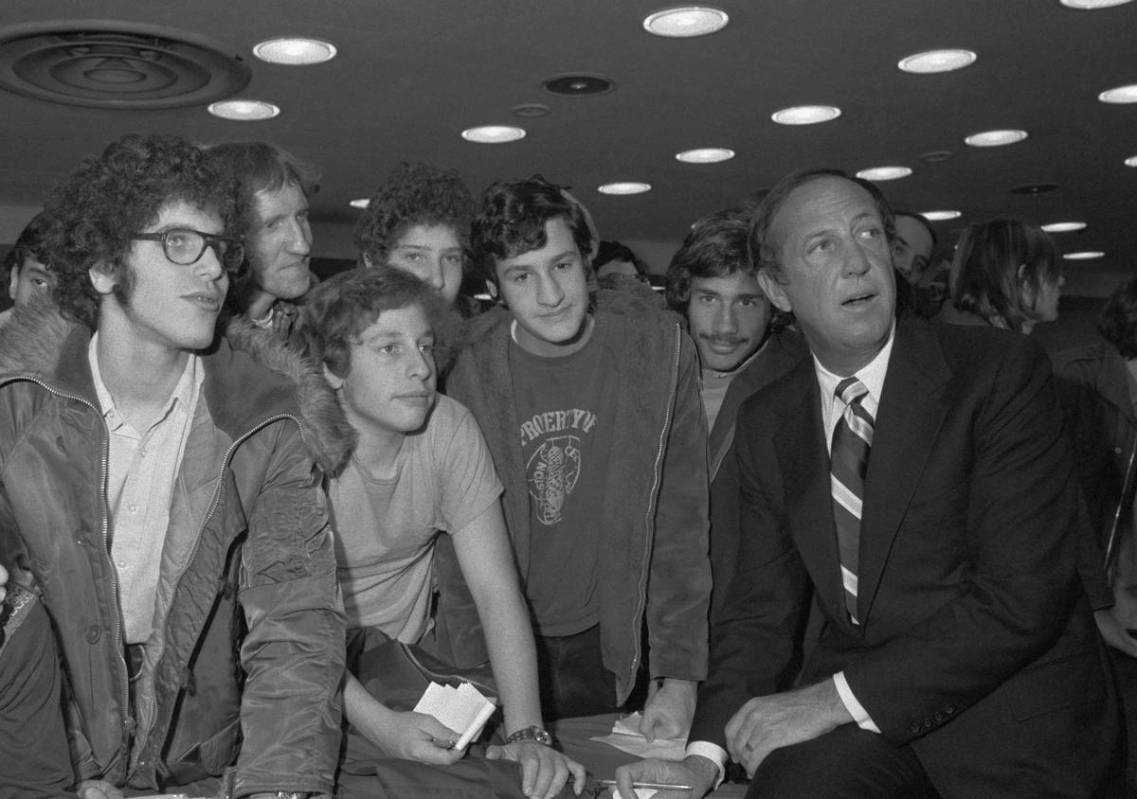 National Football League Commissioner Pete Rozelle, right, and the spectators keep their eyes o ...