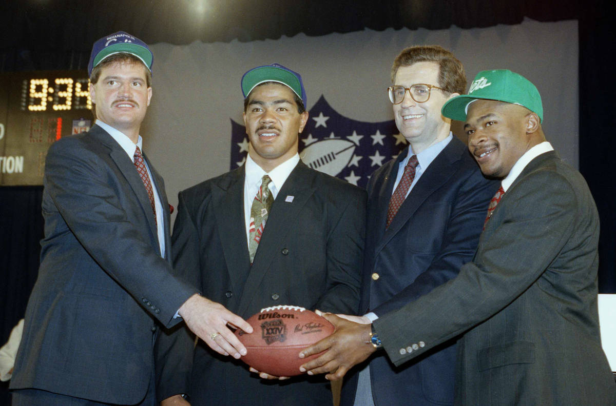 NFL Commissioner Paul Tagliabue, second from right, joins first round draft picks Jeff George, ...