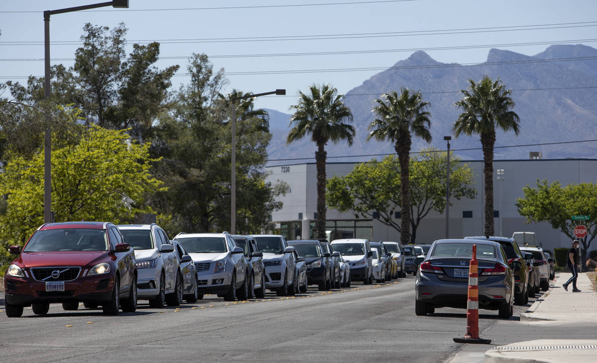 Cars line up for drive-through COVID-19 antibody testing outside PAM Speciality Hospital on Tue ...