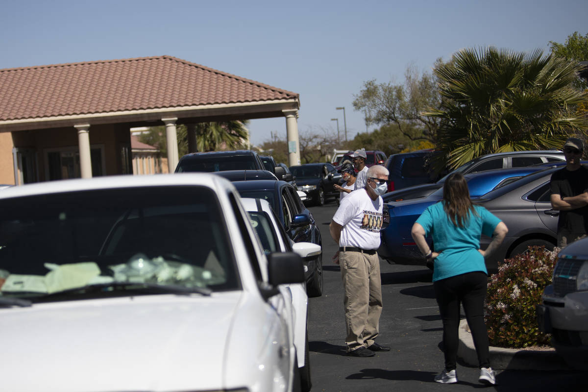 People seeking drive-through COVID-19 antibody testing, some of whom have been waiting outside ...