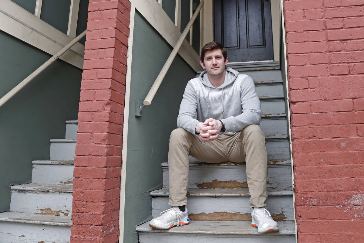 Cameron Karosis, 27, a software salesman, poses for a portrait outside his home, Tuesday, April ...