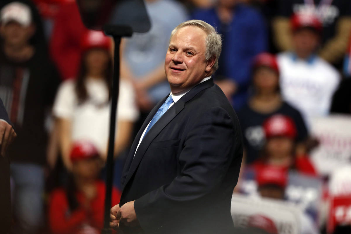 Interior Secretary David Bernhardt joins President Donald Trump as he speaks at a campaign rall ...