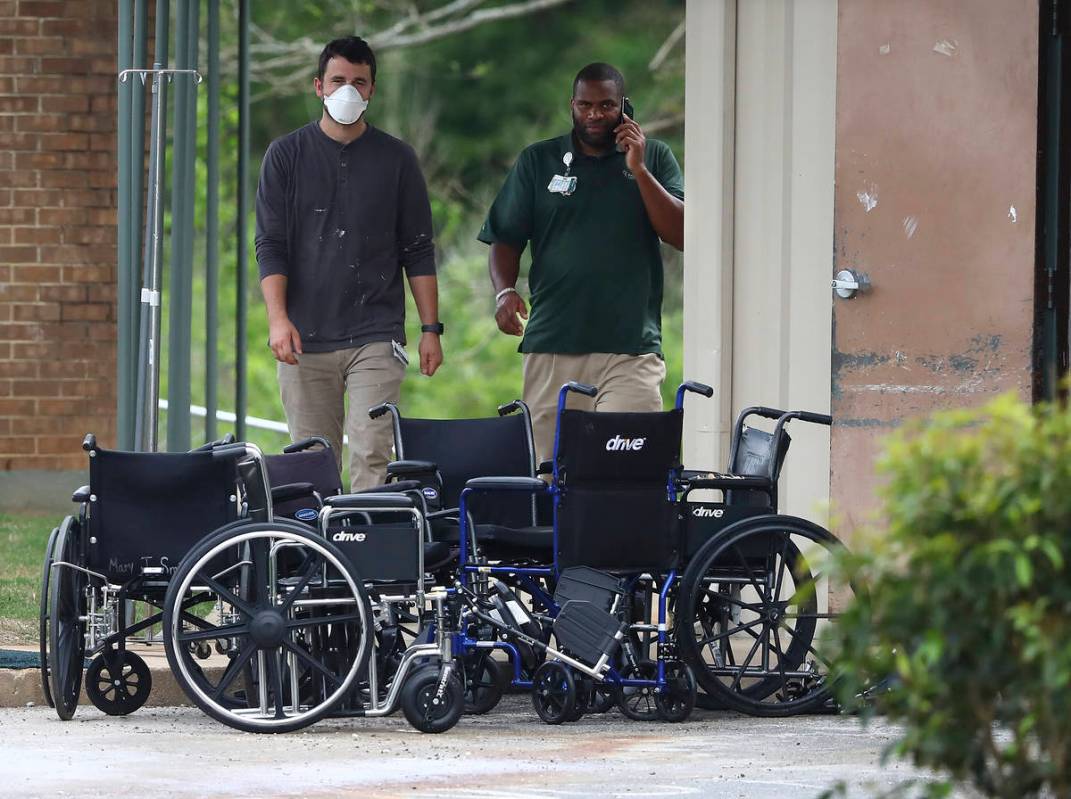 Wheelchairs are stacked at the curb outside PruittHealth Grandview nursing home where at least ...