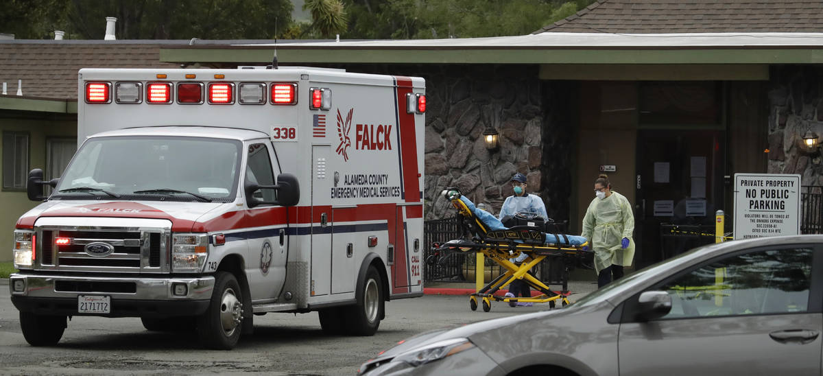 EMT's move a stretcher at the Gateway Care and Rehabilitation Center on Thursday, April 9, 2020 ...