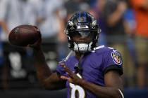 Baltimore Ravens quarterback Lamar Jackson (8) warms up prior to an NFL football game against t ...