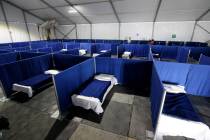 A medical tent for people who may have been exposed to the coronavirus but have no symptoms is ...