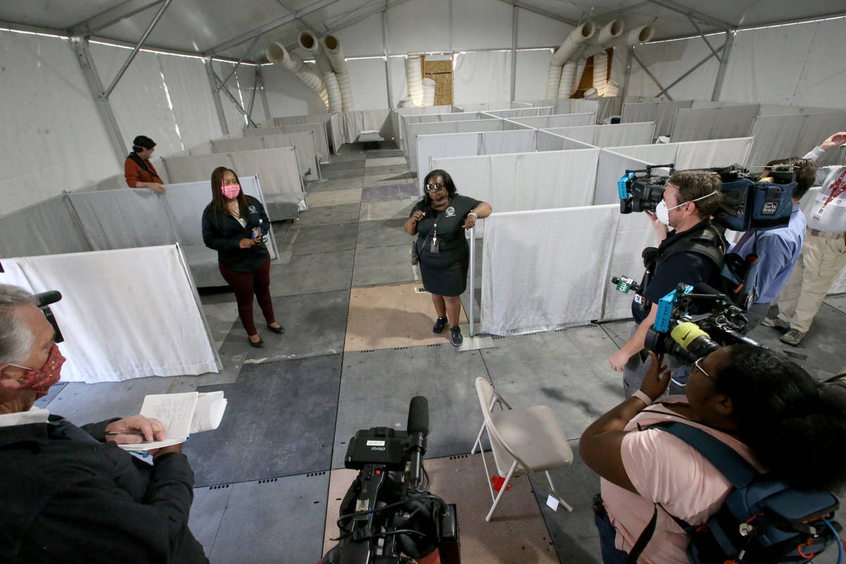 Incident Commander Dr. Lisa Morris Hibbler, left, and Complex Manager Kathi Thomas talk to the ...