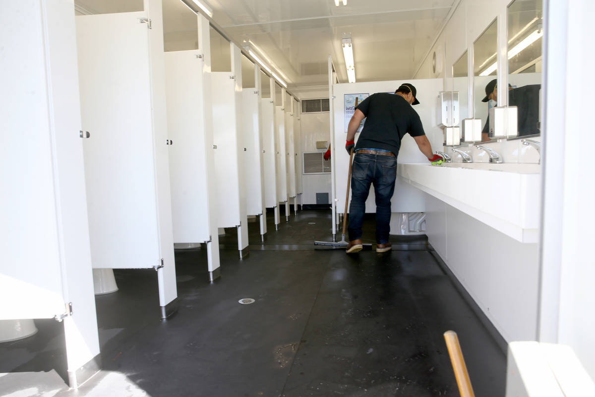 Workers prepare a restroom at the Cashman Isolation-Quarantine Complex in Las Vegas Monday, Apr ...