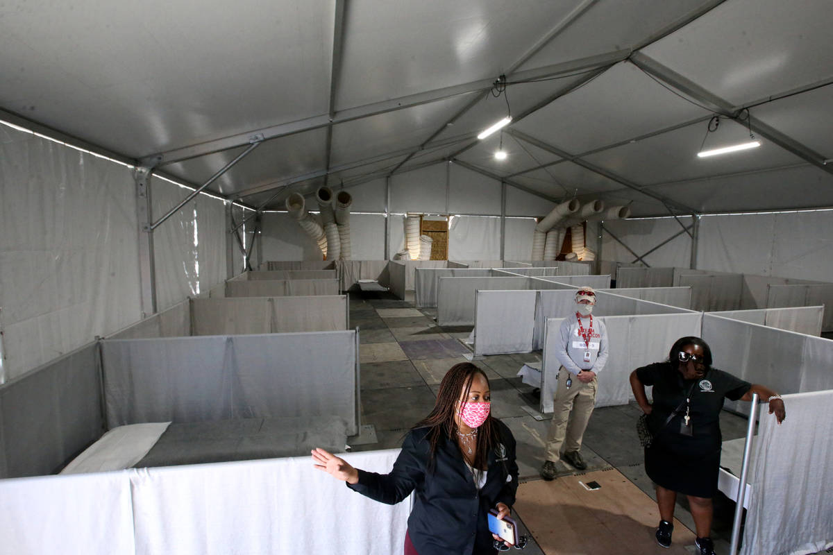 Incident Commander Dr. Lisa Morris Hibbler, left, and Complex Manager Kathi Thomas talk to the ...