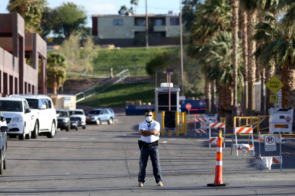 Guards monitor an entrance to the Cashman Isolation-Quarantine Complex in Las Vegas opens Monda ...