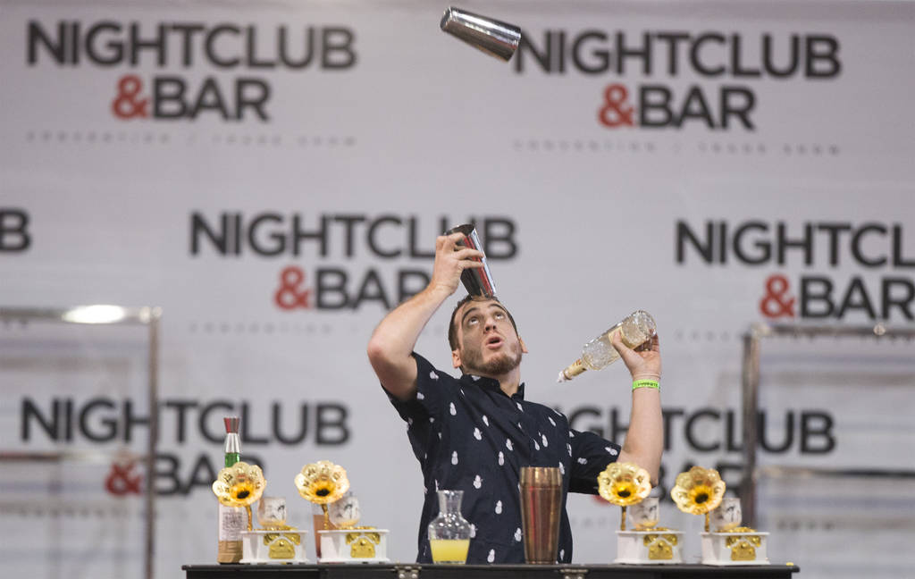 Harry Rivera performs in the flair bartending competition at the Nightclub and Bar Show on Tues ...