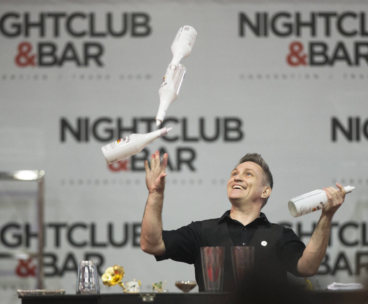Ryan Clark performs in the flair bartending competition at the Nightclub & Bar Show on Tuesday, ...