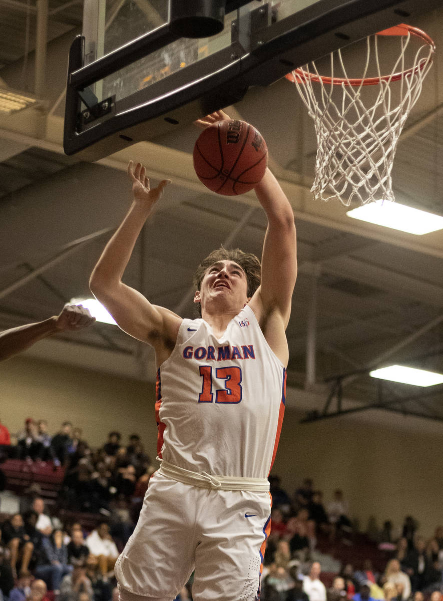 Bishop Gorman's Braden Lamar (13) dunks the ball during the game against Durango at Desert Oasi ...