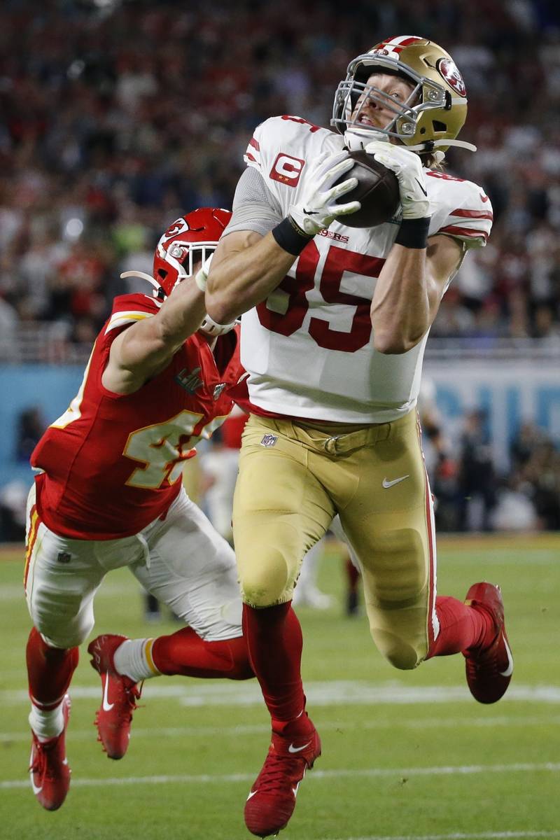 San Francisco 49ers' George Kittle (85) catches a pass in front of Kansas City Chiefs' Daniel S ...