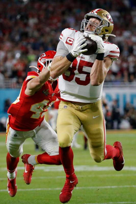 San Francisco 49ers' George Kittle (85) catches a pass in front of Kansas City Chiefs' Daniel S ...