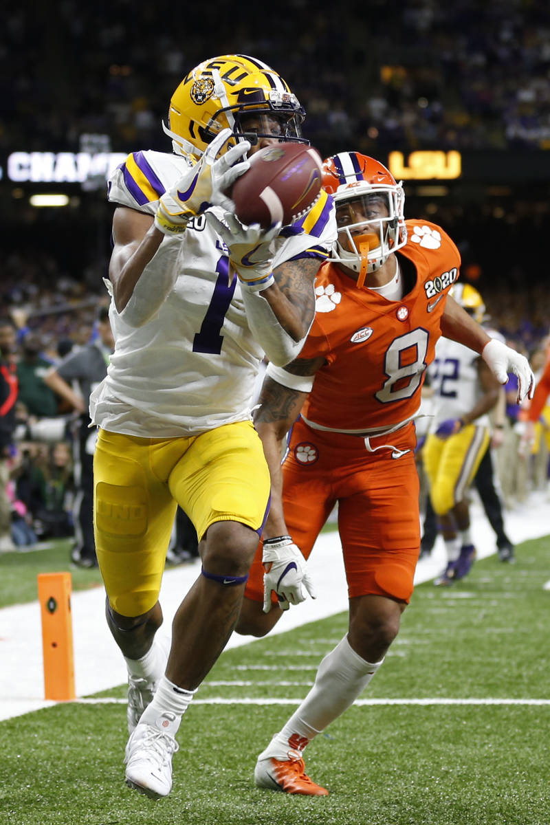 LSU wide receiver Ja'Marr Chase catches a touchdown pass in front of Clemson cornerback A.J. Te ...