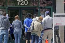 People line up outside the Utah Department of workforce Services Monday, April 13, 2020, in Sal ...