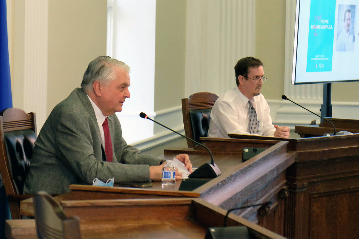 Gov. Steve Sisolak and Dr. Mark Pandori, director of Nevada State Public Health Laboratory, at ...