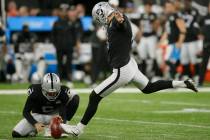Oakland Raiders kicker Daniel Carlson (8) kicks a field goal out of the hold of punter A.J. Col ...