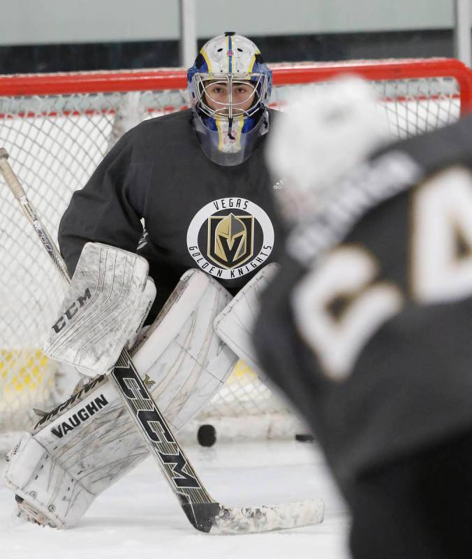 Vegas Golden Knights' goalie Jiri Patera keeps his eye on the puck during the team's developmen ...