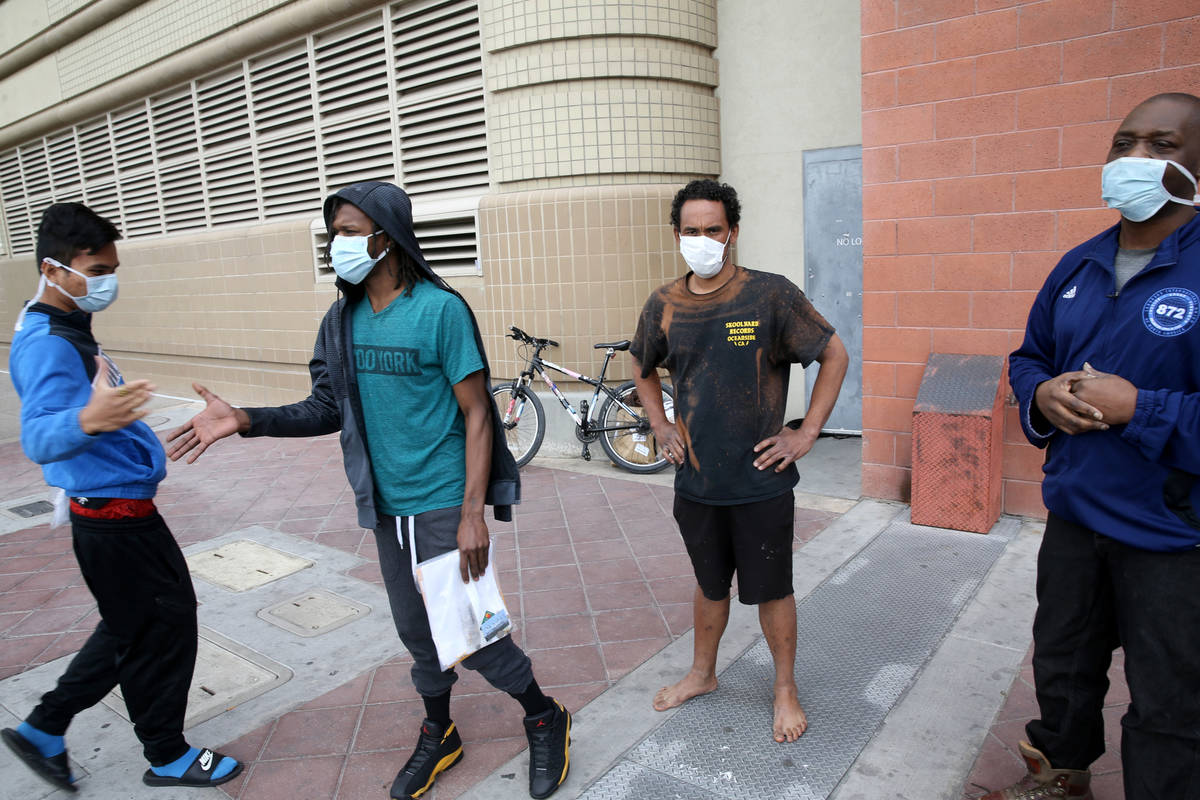 John Ricaza, 28, from left, Terry Whitehead, 21, Micah "Aqua" Peoples, 35, and Carl Parker, 52, ...